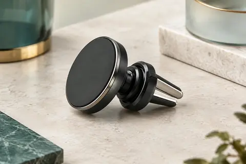 Support de voiture magnétique noir avec tête orientable et crochet métallique pour grille d’aération.
